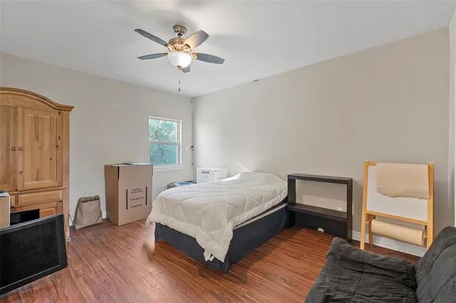 a bedroom with a bed and a table in it