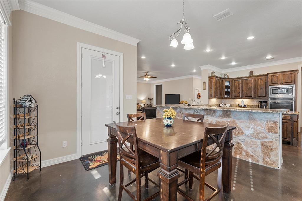 2370 Garrett Lane China Spring, TX 76633 - Photo 32 of 36 a kitchen with a dining table chairs and view kitchen