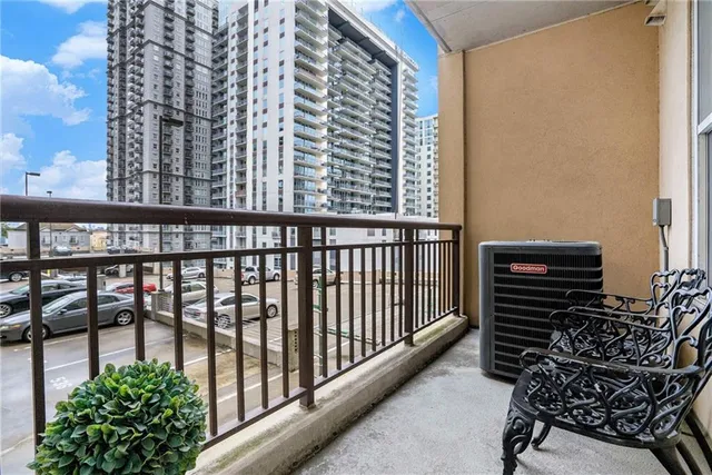 a view of balcony with furniture