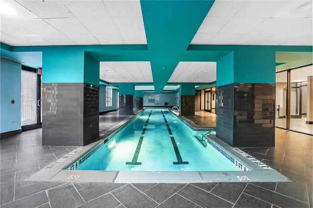 a room with lots of furniture and a wooden floor