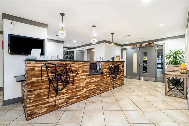 a view of a living room and entryway