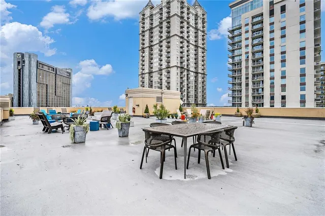 a view of a patio with table and chairs
