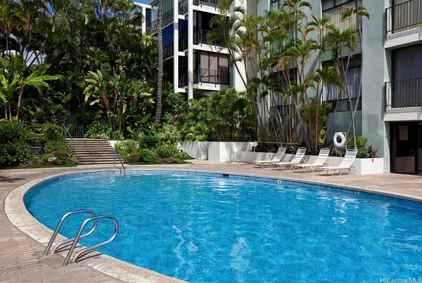 a view of fountain in the backyard of building