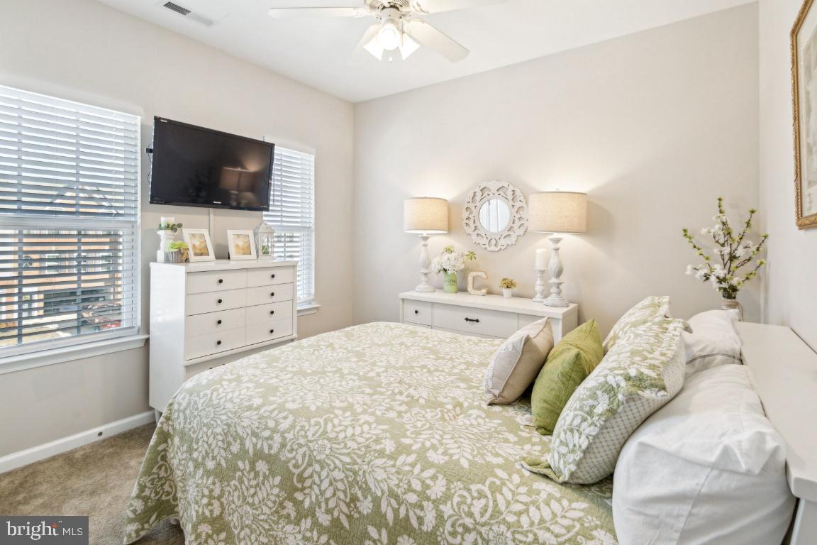 16 Grace Drive Marlton, NJ 08053 - Photo 17 of 24 a bedroom with a bed a tv and wooden floor