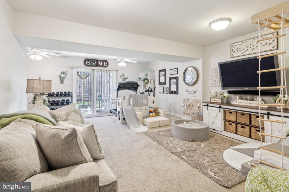 16 Grace Drive Marlton, NJ 08053 - Photo 19 of 24 a living room with furniture and a flat screen tv