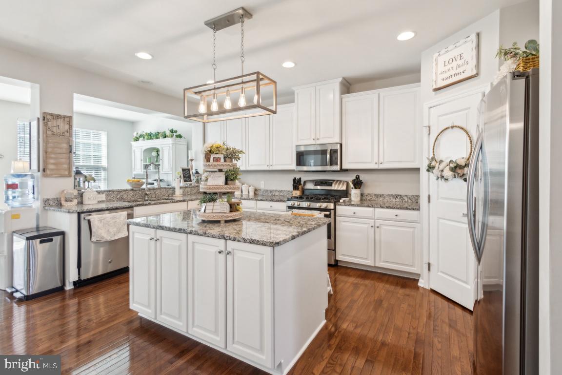16 Grace Drive Marlton, NJ 08053 - Photo 7 of 24 a kitchen with white cabinets stainless steel appliances and wooden floor