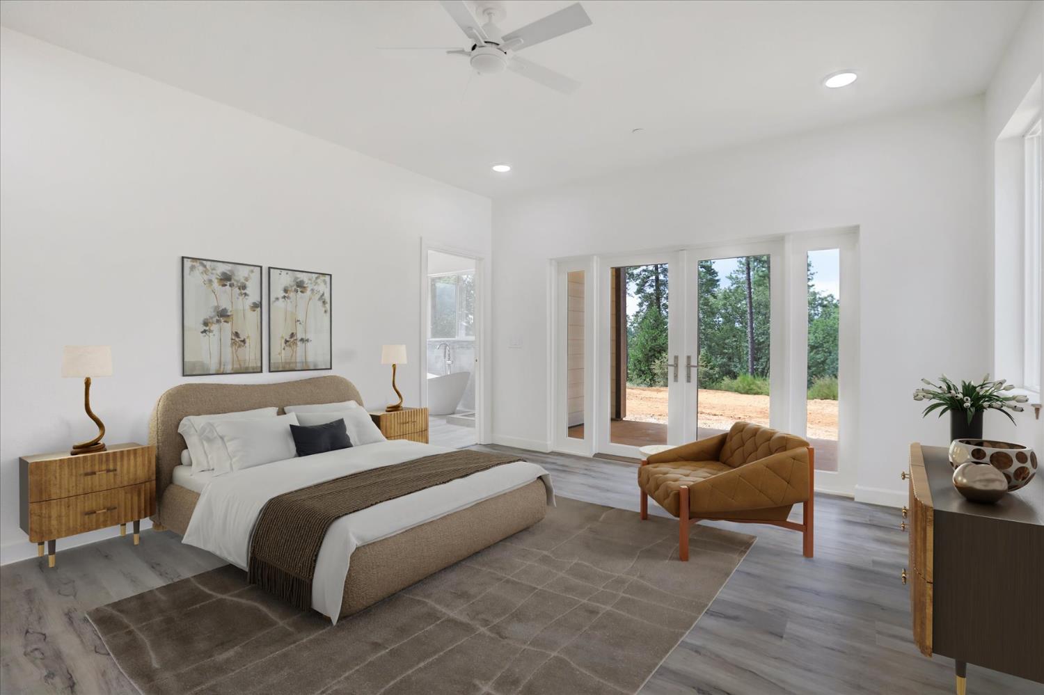 10279 Evergreen Ranch Court Grass Valley, CA 95949 - Photo 11 of 79 a spacious bedroom with a bed and glass window