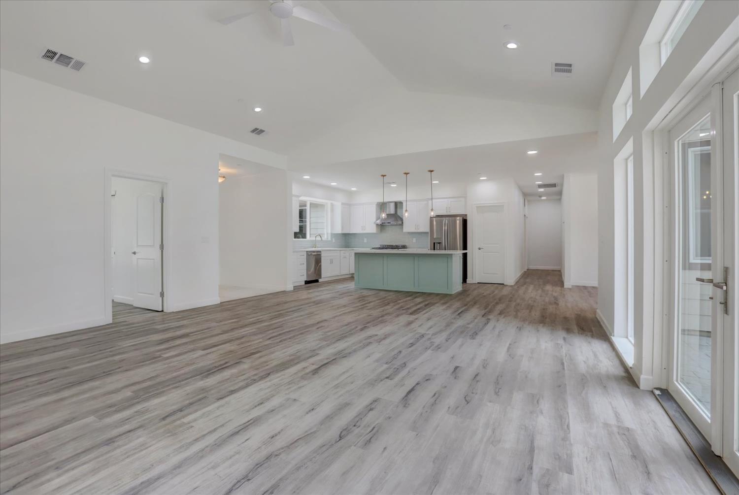 10279 Evergreen Ranch Court Grass Valley, CA 95949 - Photo 22 of 79 a view of kitchen with refrigerator stove and wooden floor