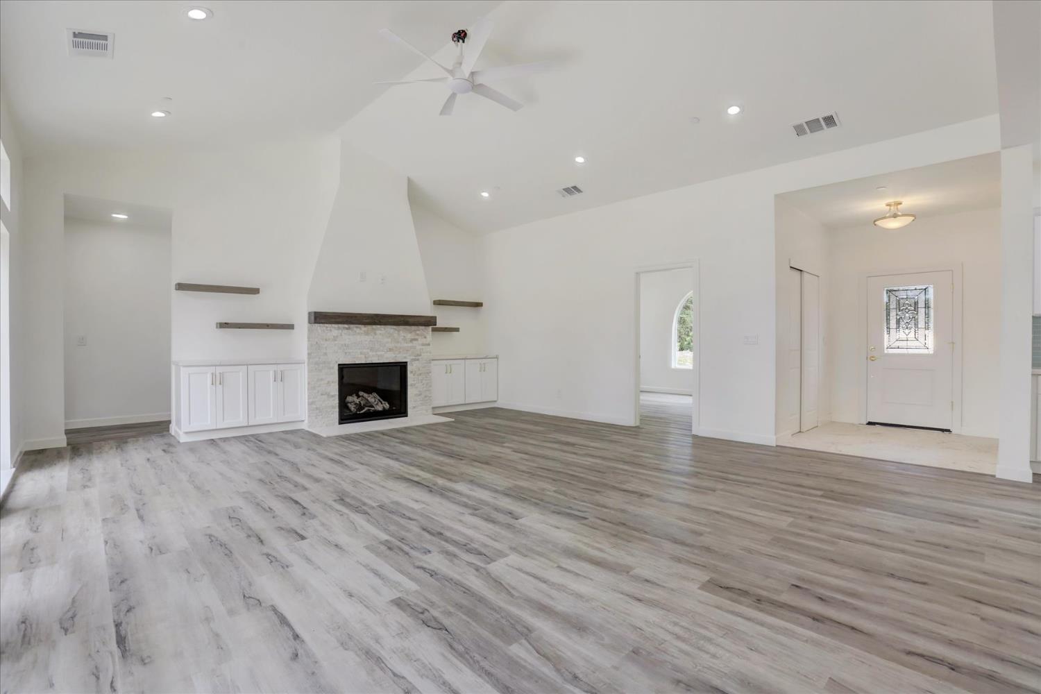 10279 Evergreen Ranch Court Grass Valley, CA 95949 - Photo 24 of 79 a view of empty room with wooden floor and fireplace