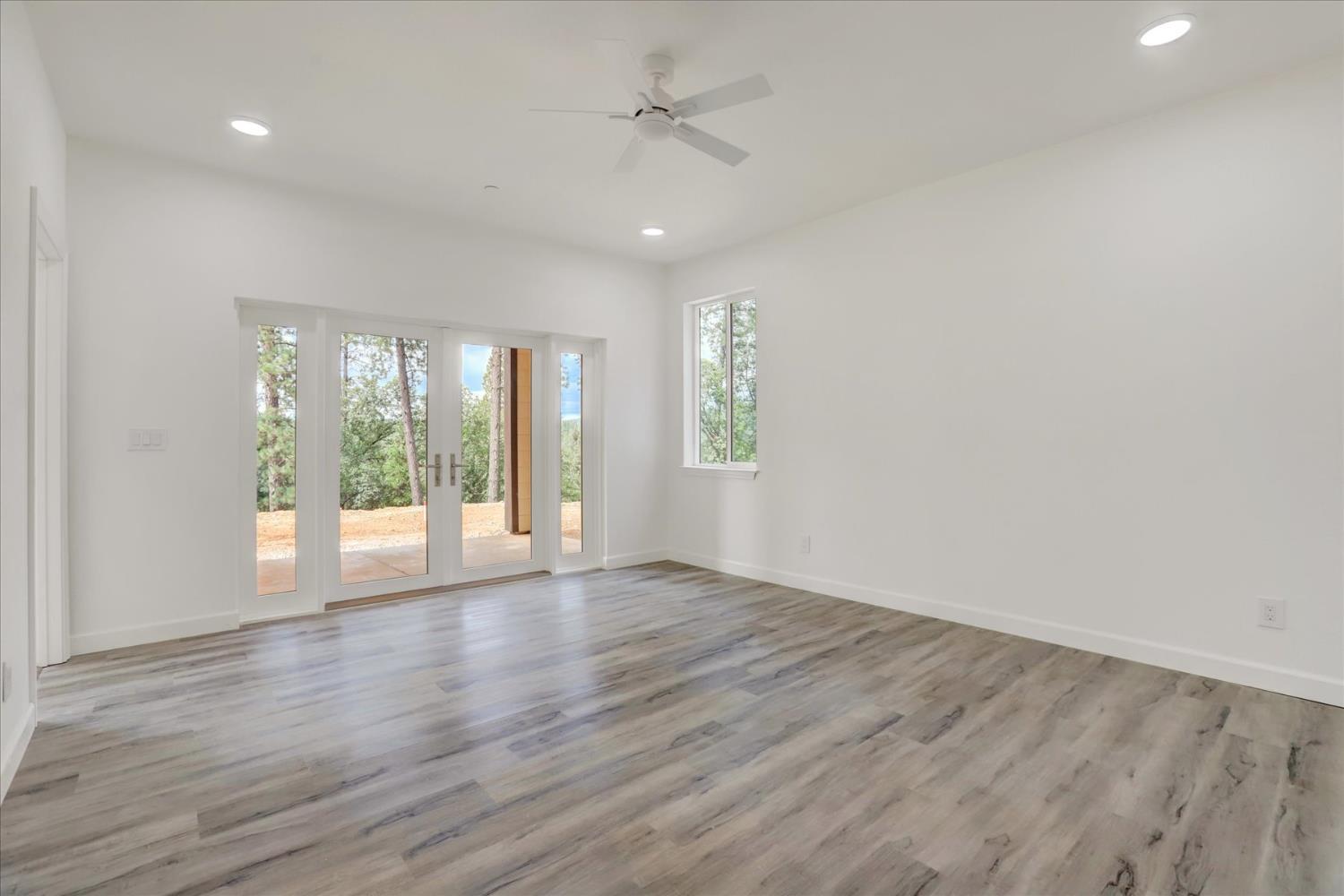 10279 Evergreen Ranch Court Grass Valley, CA 95949 - Photo 42 of 79 wooden floor in an empty room with a window