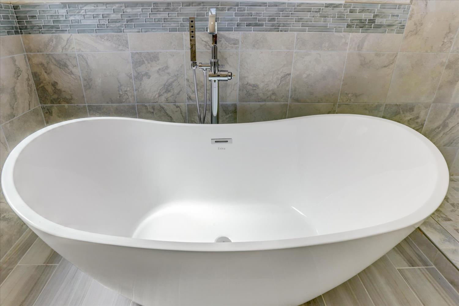 10279 Evergreen Ranch Court Grass Valley, CA 95949 - Photo 47 of 79 a white bath tub sitting in a bathroom