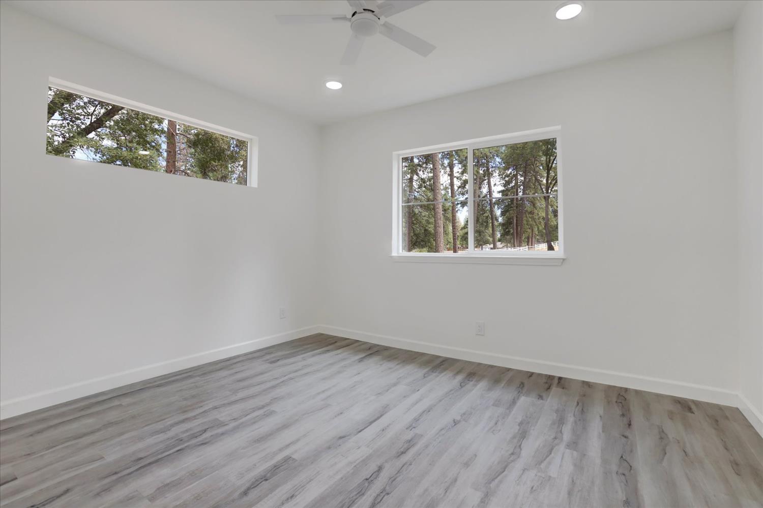 10279 Evergreen Ranch Court Grass Valley, CA 95949 - Photo 53 of 79 wooden floor in an empty room with a window