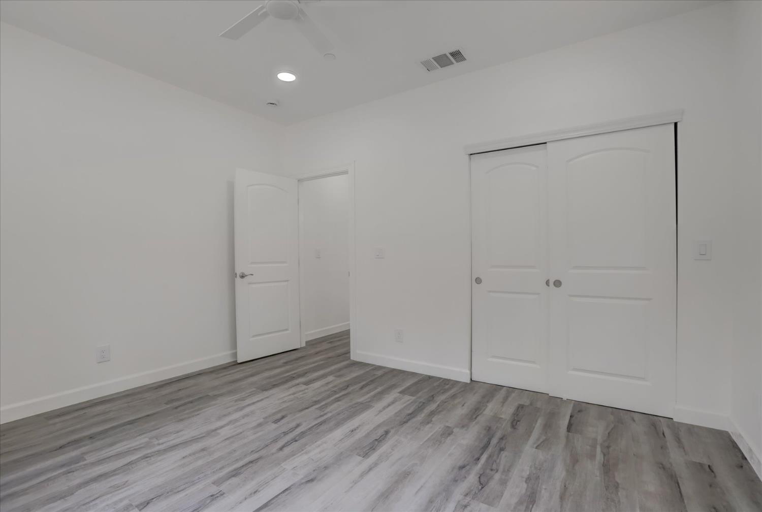 10279 Evergreen Ranch Court Grass Valley, CA 95949 - Photo 55 of 79 a view of an empty room with wooden floor