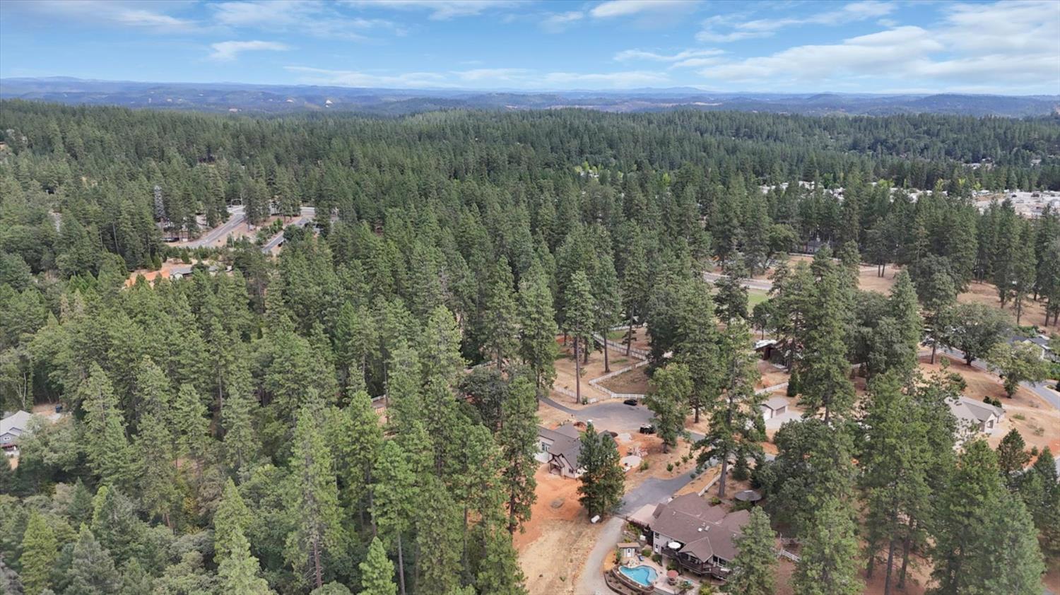 10279 Evergreen Ranch Court Grass Valley, CA 95949 - Photo 67 of 79 a view of a city with lush green forest