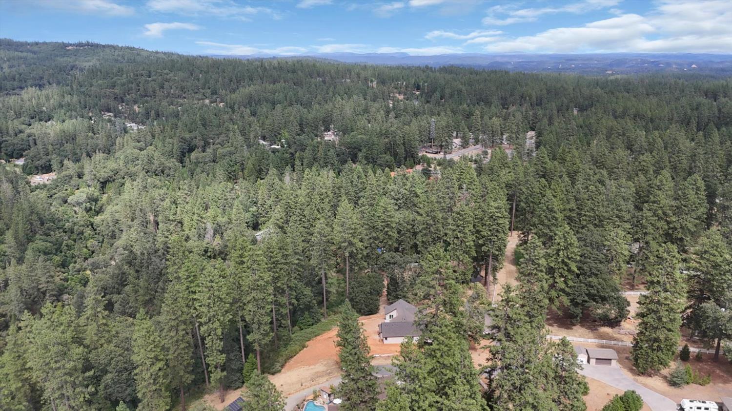 10279 Evergreen Ranch Court Grass Valley, CA 95949 - Photo 68 of 79 a view of a city with lush green forest