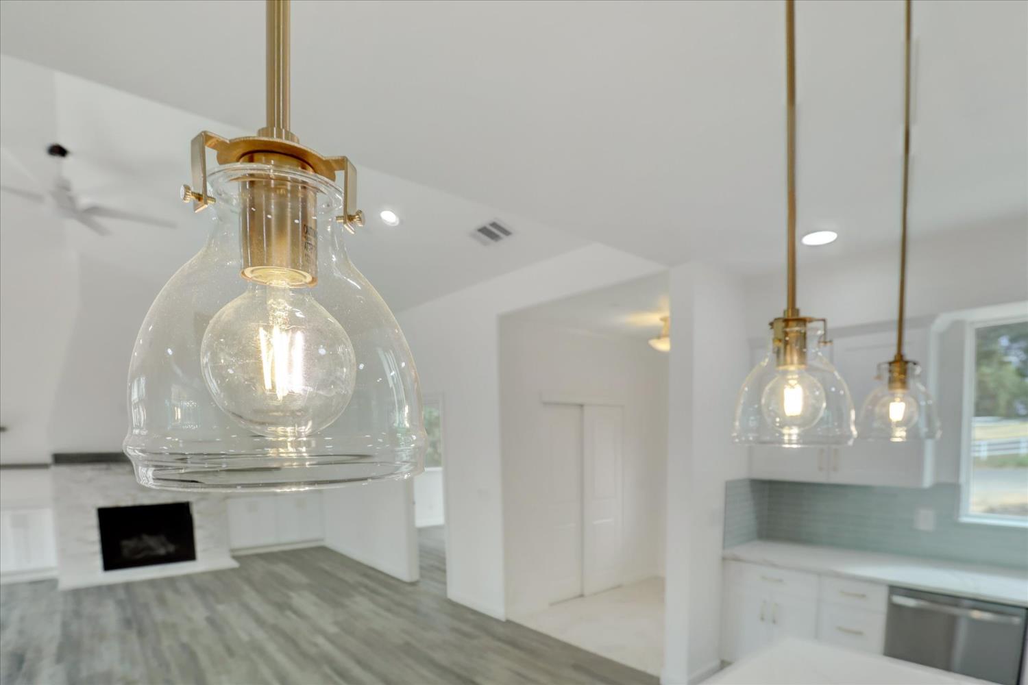 10279 Evergreen Ranch Court Grass Valley, CA 95949 - Photo 7 of 79 a room with water heater and wooden cabinets