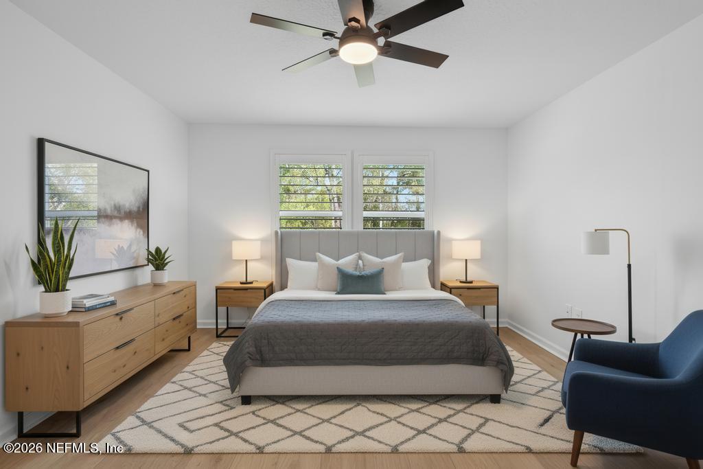 45 Seaport Breeze Road St. Augustine, FL 32095 - Photo 67 of 88 a bedroom with a large bed and a flat screen tv