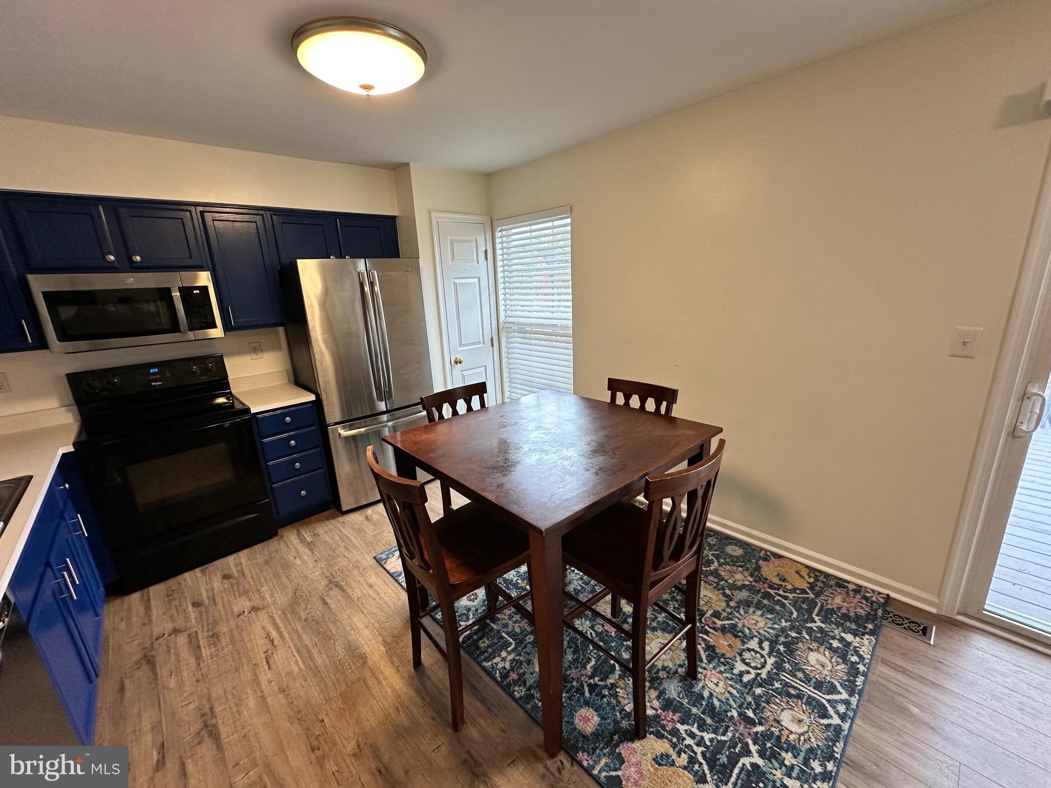 22 Carper Street Bear, DE 19701 - Photo 15 of 56 a view of a dining room with furniture and wooden floor