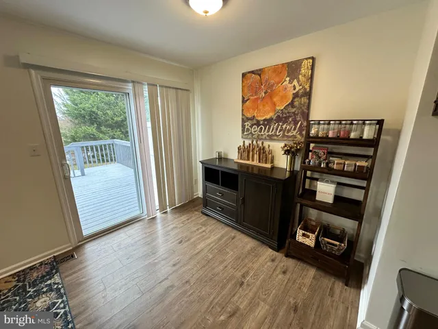 a kitchen with granite countertop wooden cabinets and stainless steel appliances