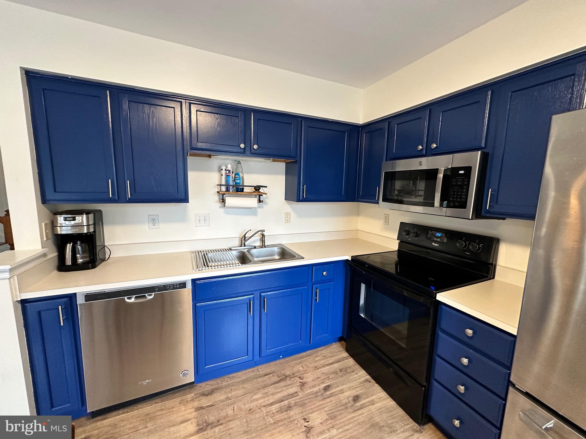 22 Carper Street Bear, DE 19701 - Photo 19 of 56 a kitchen with granite countertop wooden cabinets and stainless steel appliances