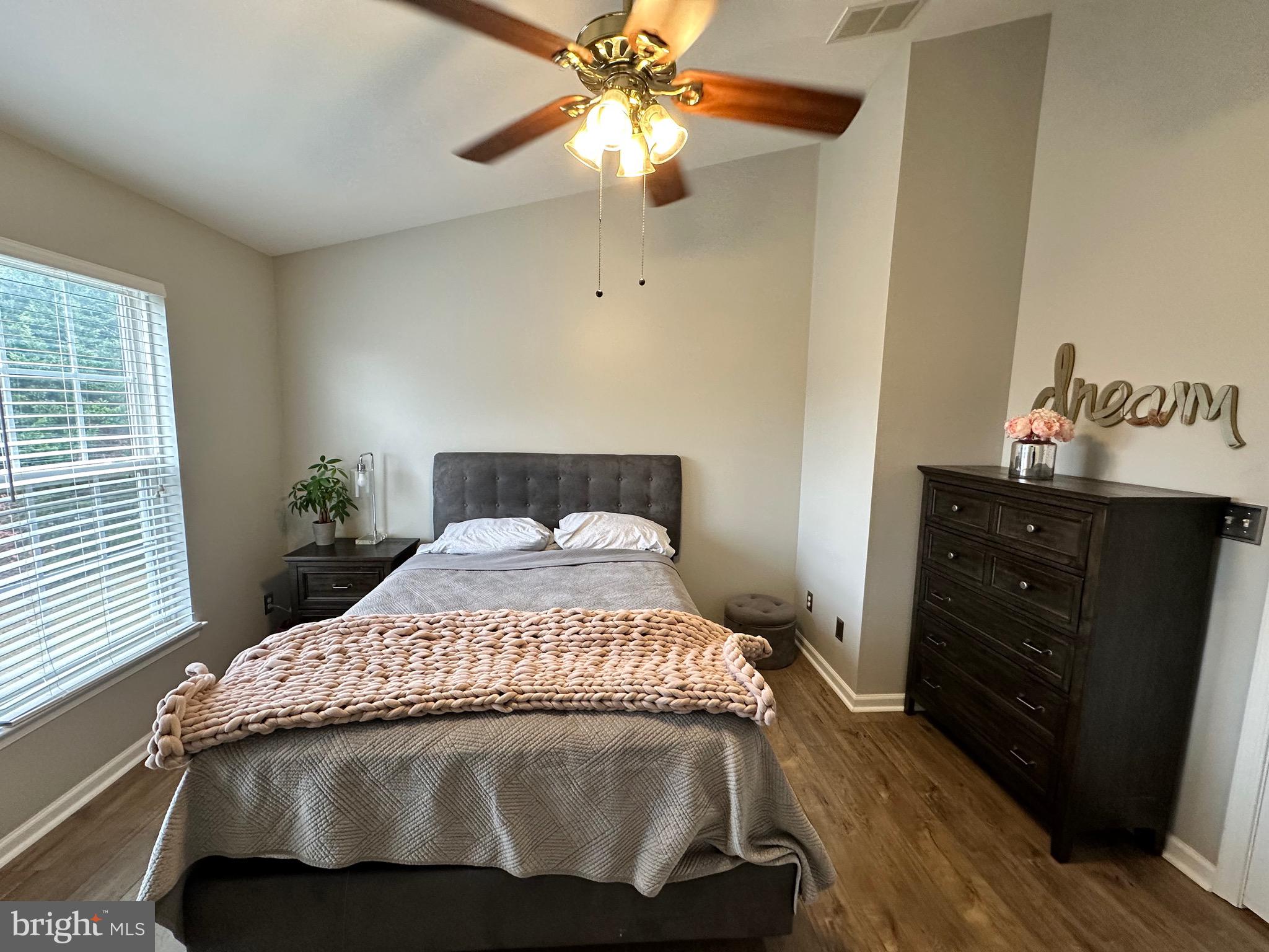 22 Carper Street Bear, DE 19701 - Photo 24 of 56 a bedroom with a bed and a chandelier