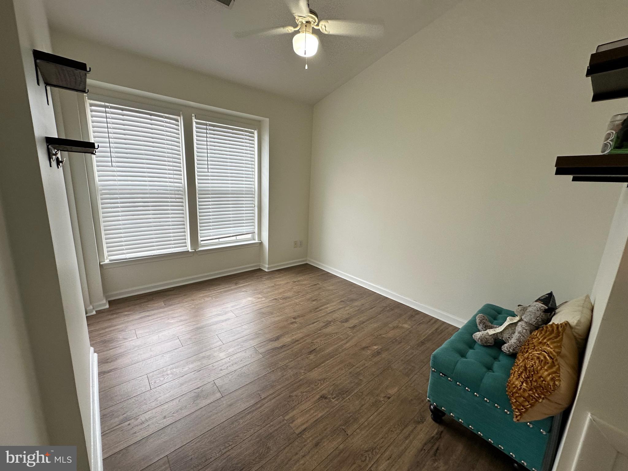 22 Carper Street Bear, DE 19701 - Photo 30 of 56 wooden floor in an empty room with a window
