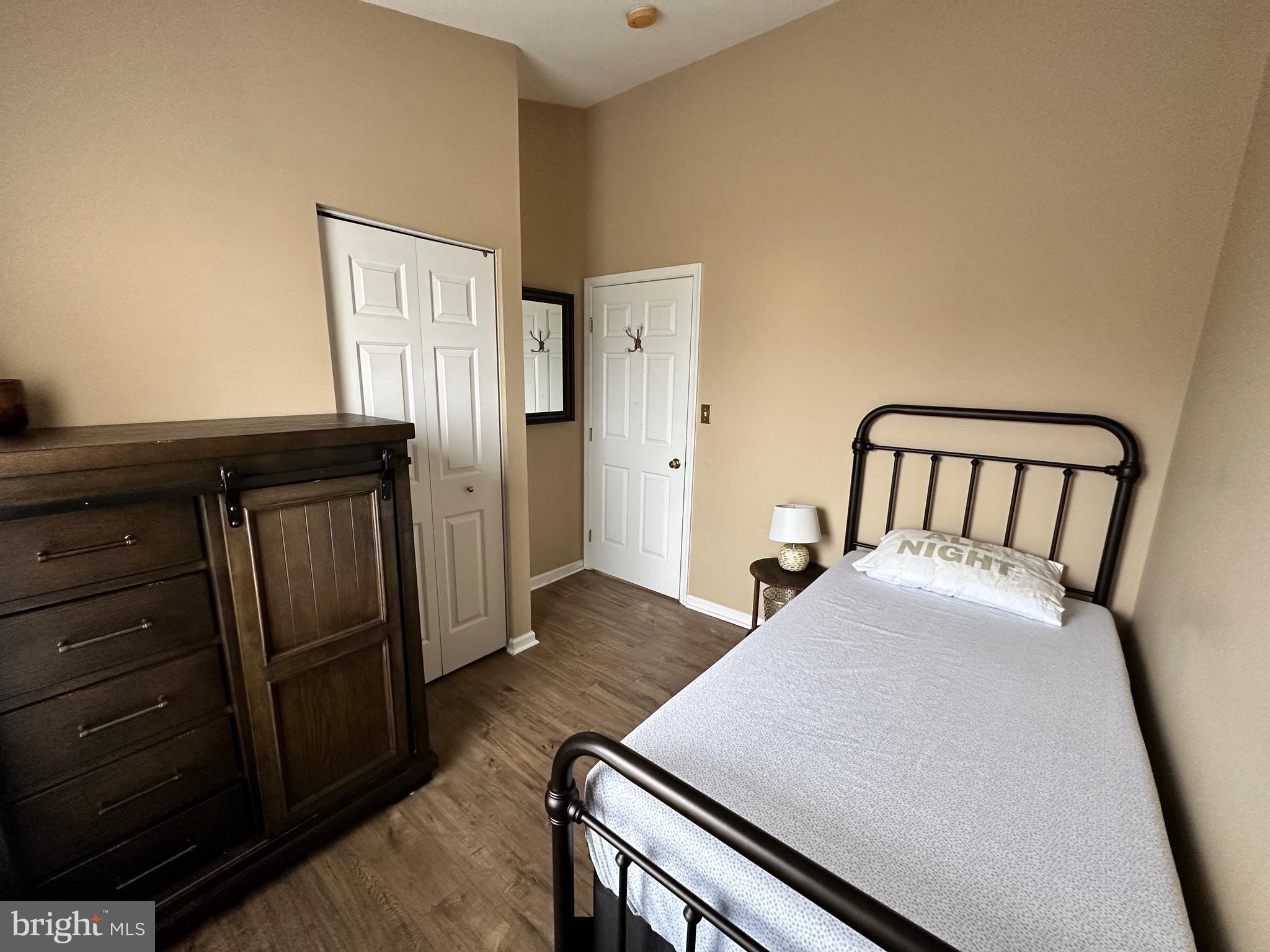 22 Carper Street Bear, DE 19701 - Photo 33 of 56 a bedroom with a bed and wooden floor