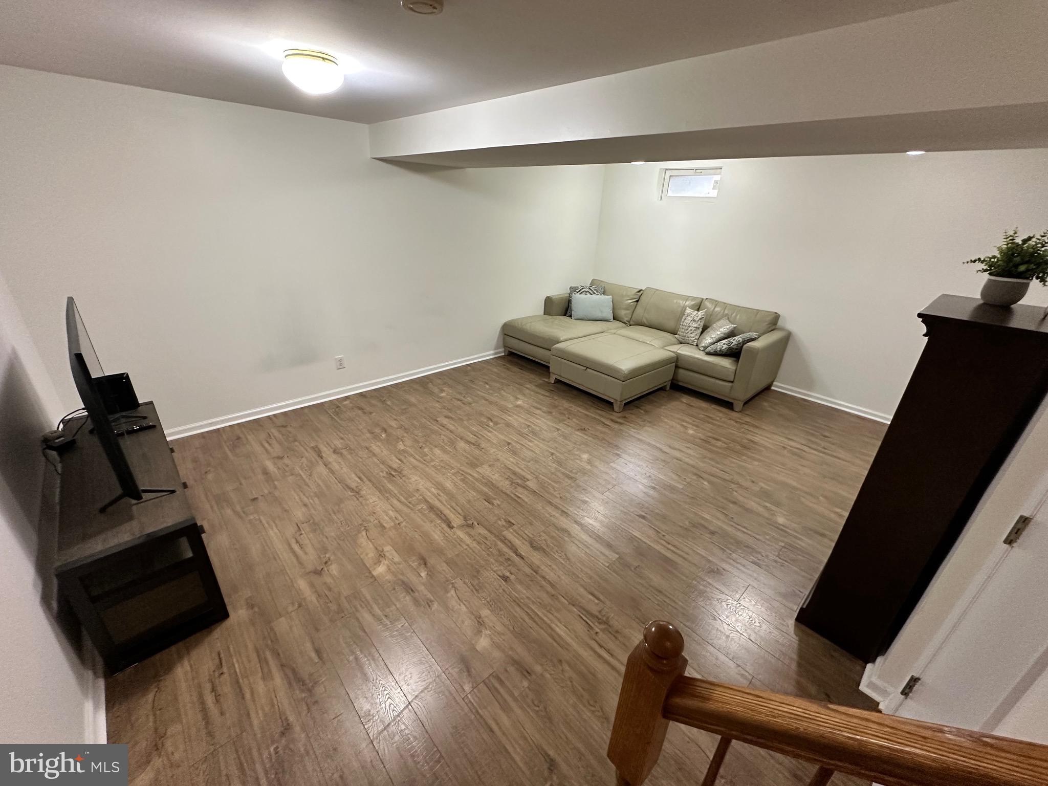 22 Carper Street Bear, DE 19701 - Photo 38 of 56 a living room with furniture and a flat screen tv
