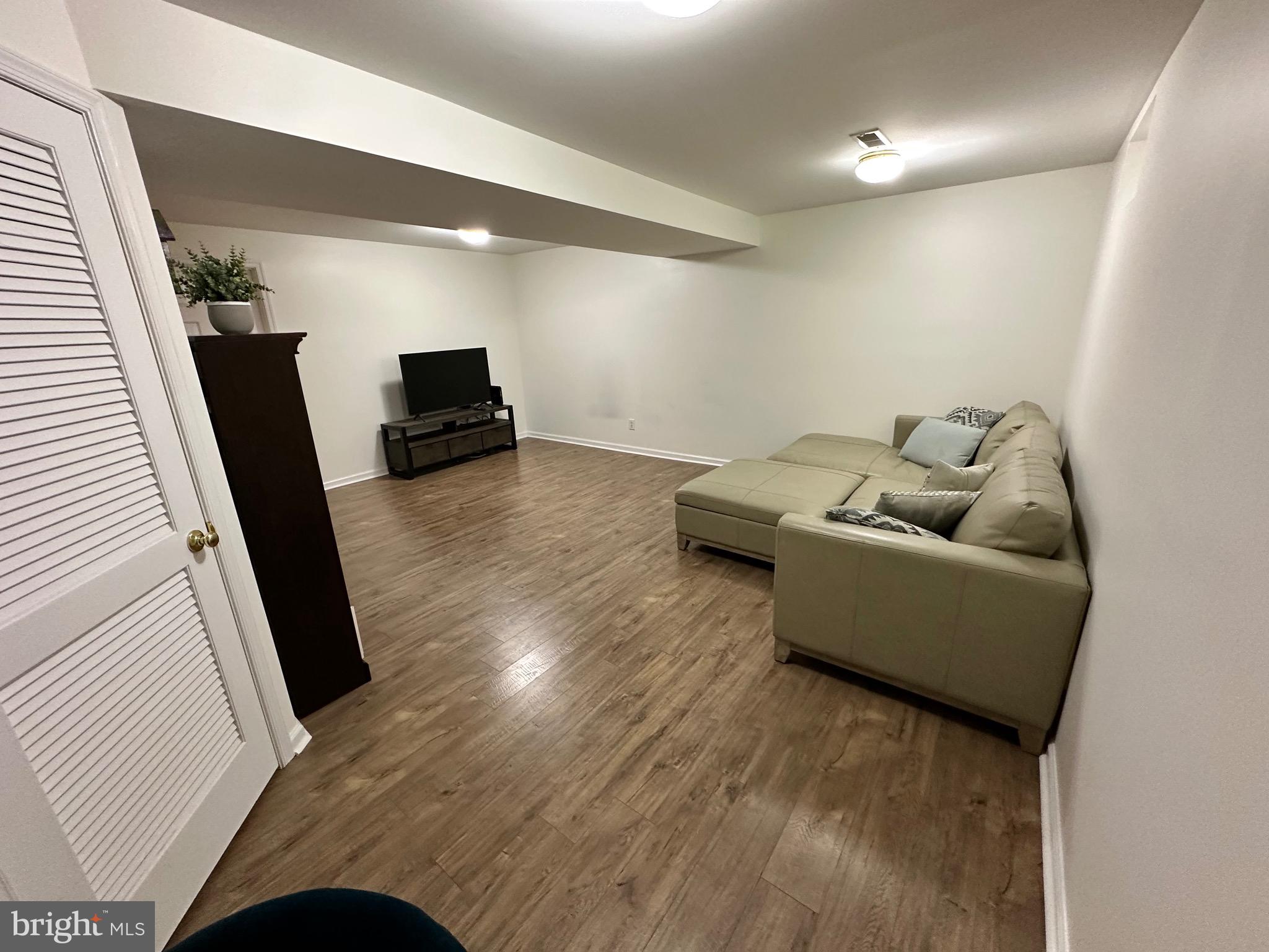 22 Carper Street Bear, DE 19701 - Photo 41 of 56 a living room with furniture and a couch