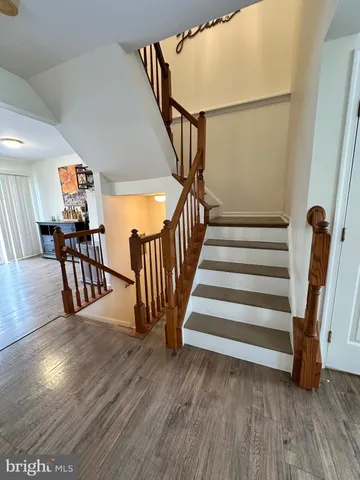 a view of balcony with wooden floor and outdoor seating