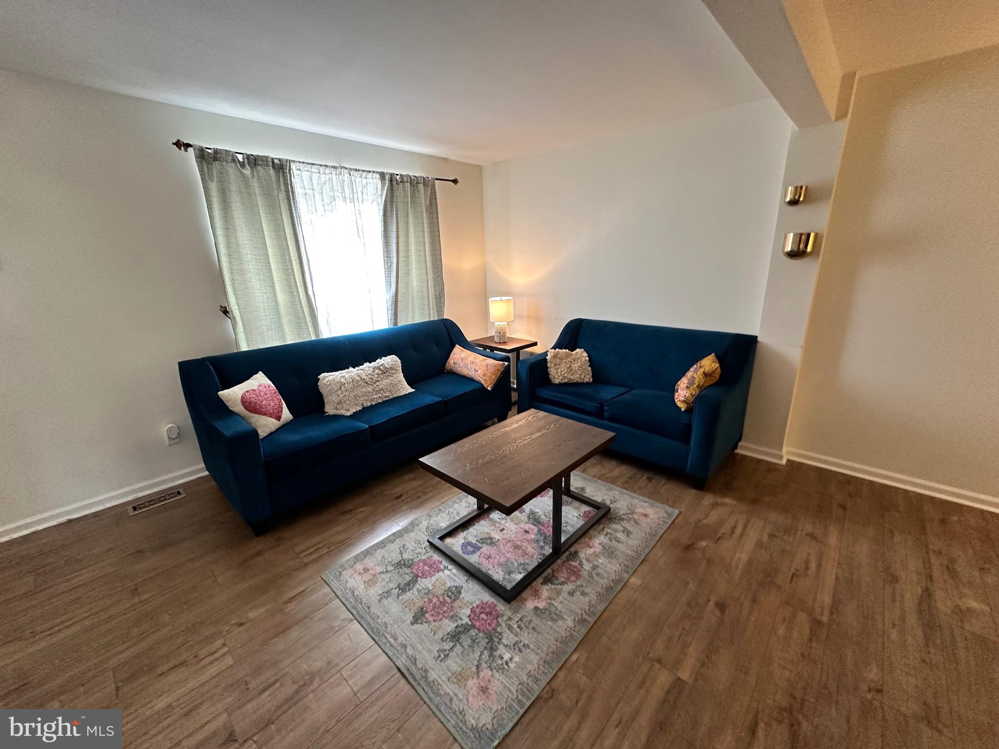 22 Carper Street Bear, DE 19701 - Photo 8 of 56 a living room with furniture and a wooden floor