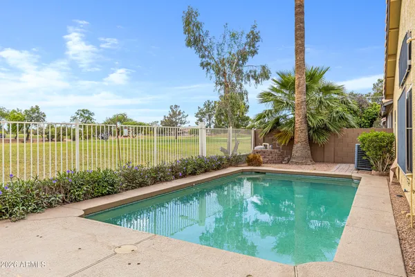 a view of a swimming pool with a garden