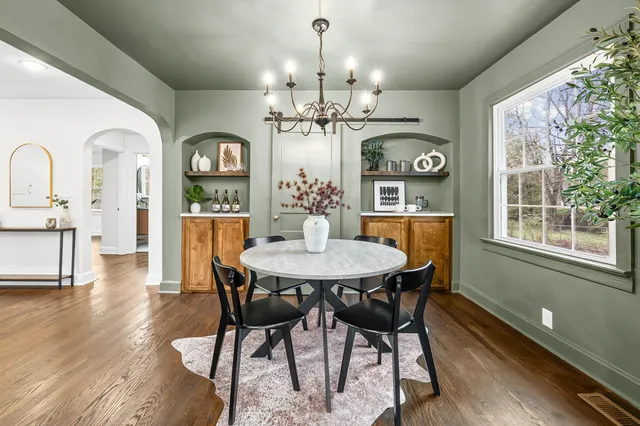 a view of a dining room with furniture window and wooden floor