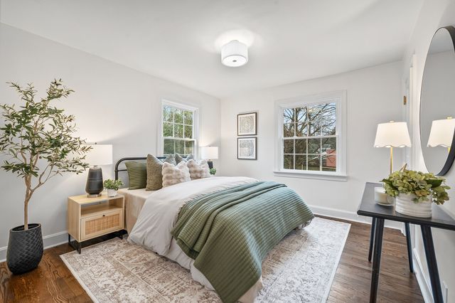 a bedroom with bed and a couch