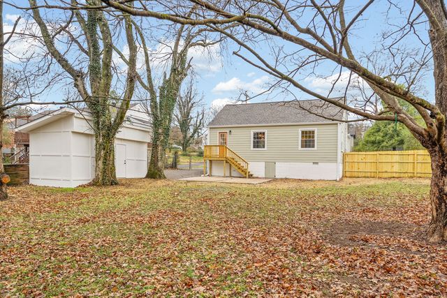 a house with trees in front of it