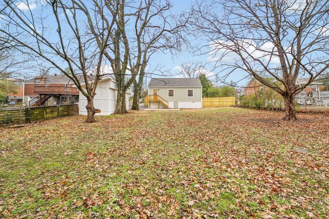 a house that has a tree in front of it