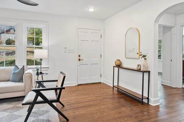 a view of a livingroom with furniture and wooden floor
