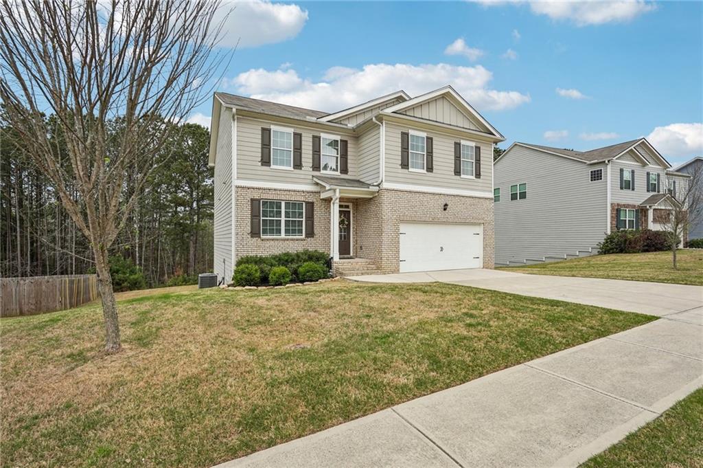 88 Cool Creek Court Dallas, GA 30132 - Photo 2 of 41 a view of an house with backyard and trees