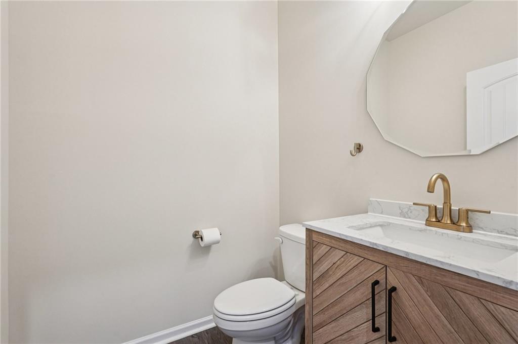 88 Cool Creek Court Dallas, GA 30132 - Photo 21 of 41 a bathroom with a sink a toilet and a mirror
