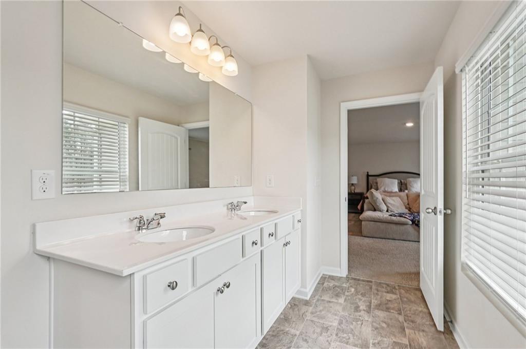 88 Cool Creek Court Dallas, GA 30132 - Photo 26 of 41 a en suite bathroom with a sink double vanity and a mirror