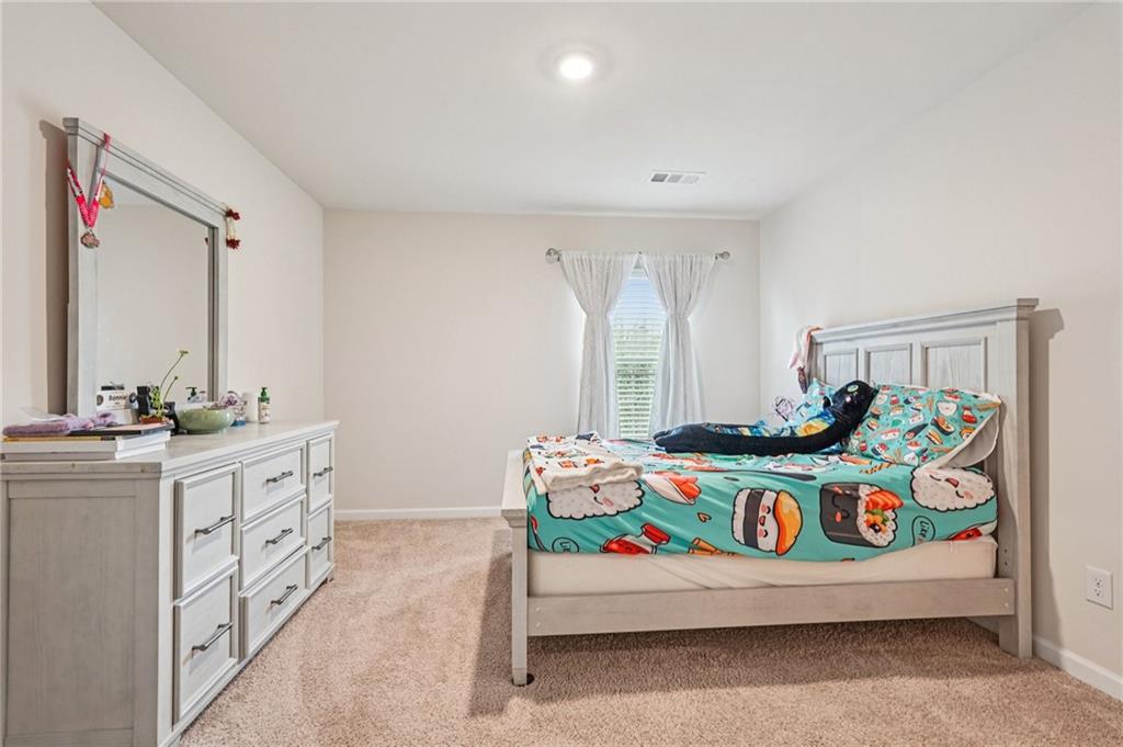 88 Cool Creek Court Dallas, GA 30132 - Photo 29 of 41 a bedroom with bed and window