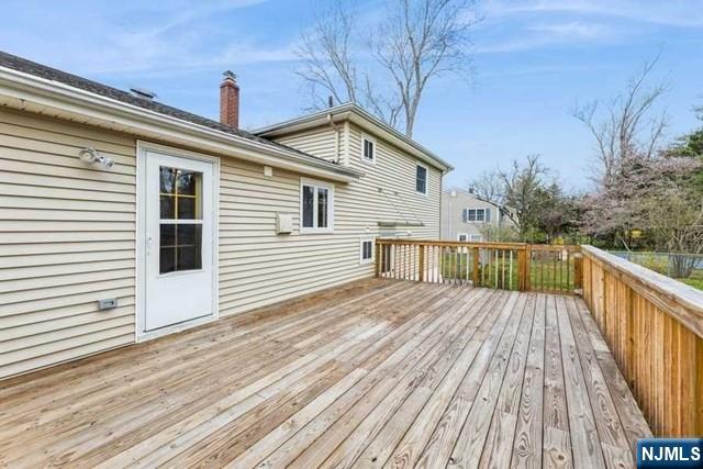 23 Asmus Road Closter, NJ 07624 - Photo 33 of 38 a view of a house with a deck