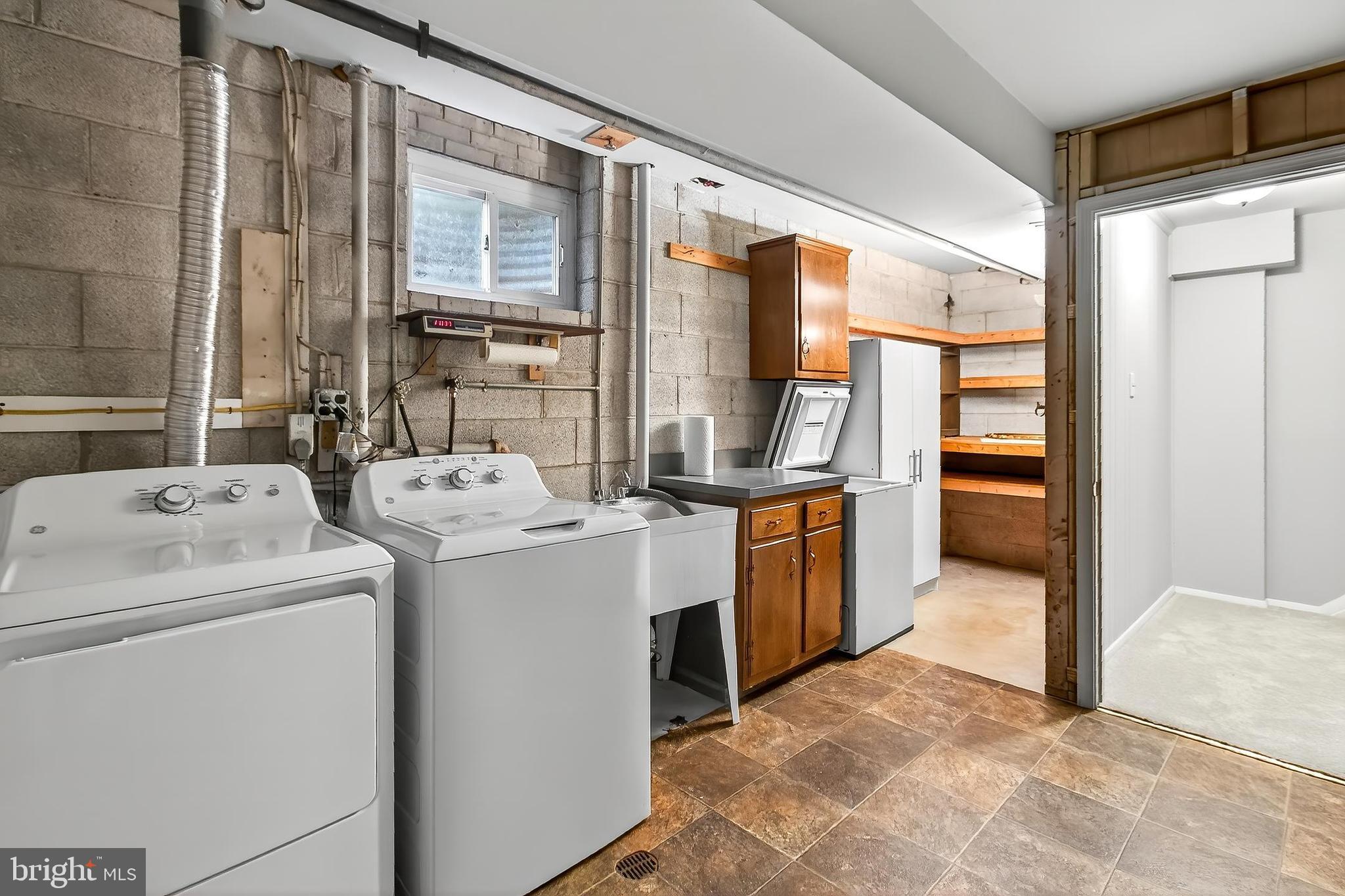 7781 Tiverton Drive Springfield, VA 22152 - Photo 32 of 53 Extra chest freezer conveys + shelving & cabinets