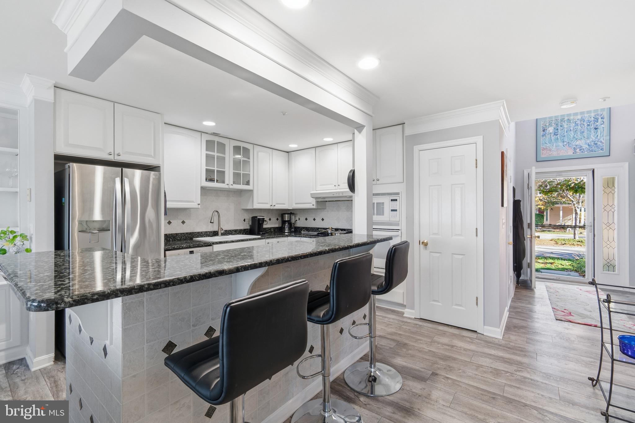 906 Auckland Way Chester, MD 21619 - Photo 4 of 36 Kitchen with white cabinetry and granite counters