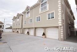 1051 Oceanfront, Unit 7 Long Beach, NY 11561 - Photo 1 of 15 a view of a building with a street