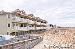 1051 Oceanfront, Unit 7 Long Beach, NY 11561 - Photo 4 of 15 a large building with a view of a building
