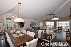 1051 Oceanfront, Unit 7 Long Beach, NY 11561 - Photo 6 of 15 a living room with furniture and a large window