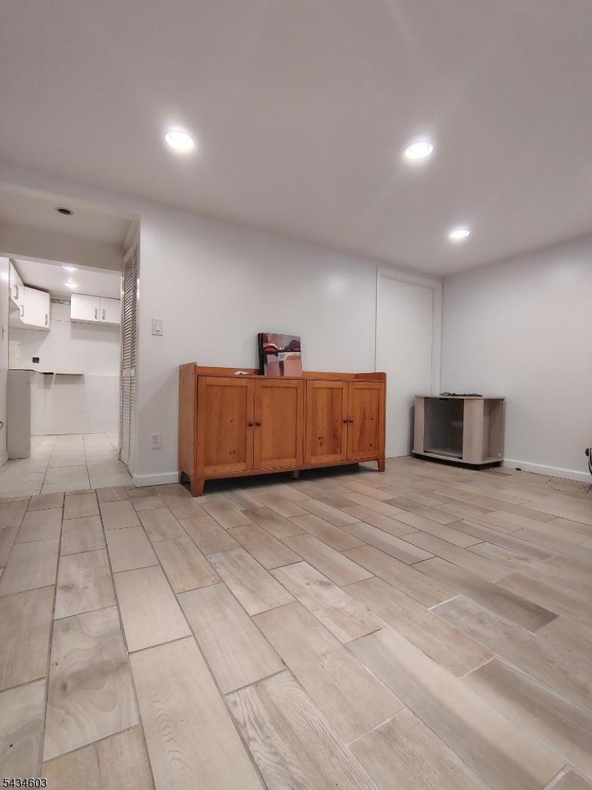 442 River Road North Arlington, NJ 07031 - Photo 19 of 26 a view of room with furniture and wooden floor