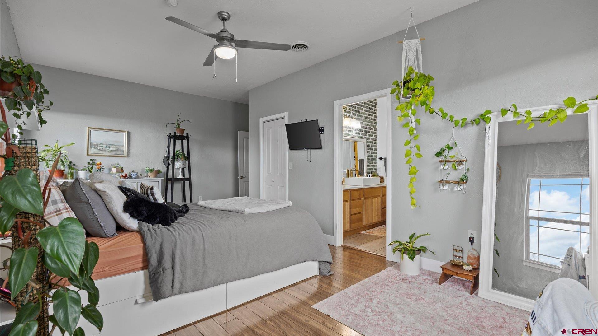 20866 Trophy Road Montrose, CO 81403 - Photo 14 of 29 a bedroom with furniture and a wooden floor