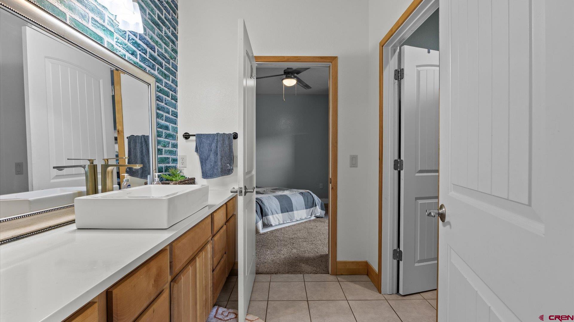 20866 Trophy Road Montrose, CO 81403 - Photo 15 of 29 a bathroom with a tub sink and mirror